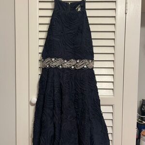 Elegant Black Textured Dress with Embellished Waist